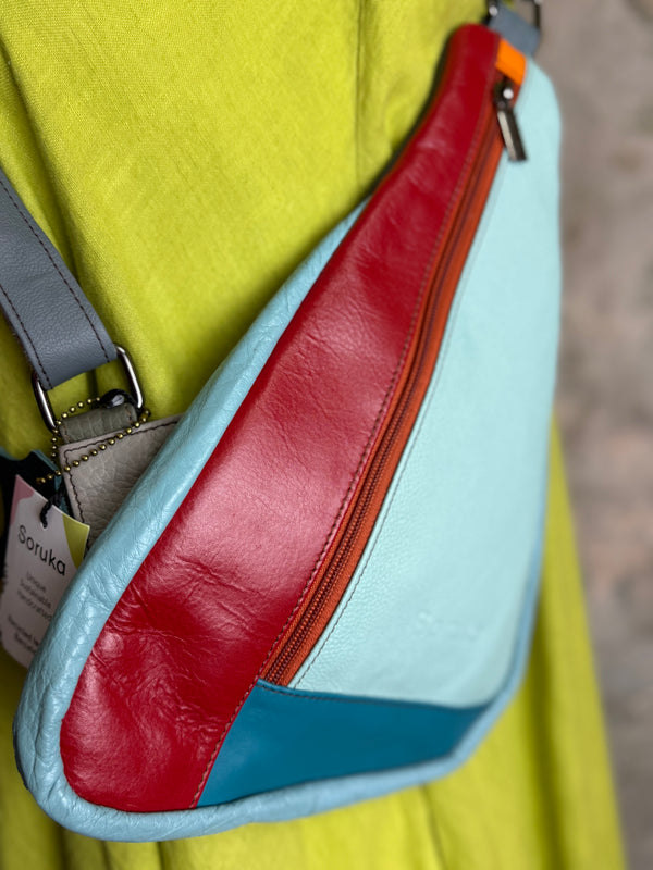 Soruka multicolor leather sling crossbody bag in light blue, red, and teal with orange zipper detail - 7
