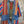 Load image into Gallery viewer, Boho serape striped duster cardigan with denim pockets, styled with red bead necklace and belt on mannequin - 9
