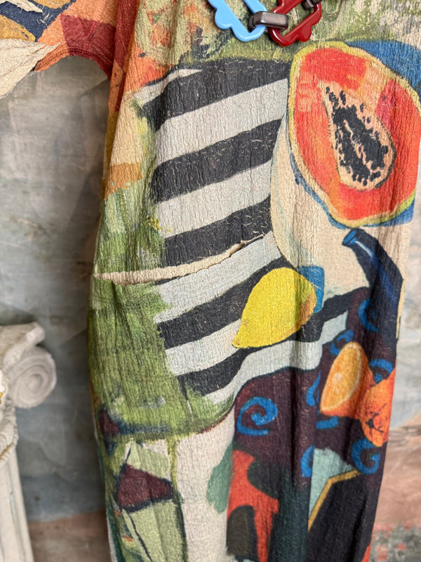 D541 waffle knit cowlneck dress featuring vibrant abstract fruit and geometric mixed print, draped on mannequin - 15
