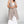 Load image into Gallery viewer, Long black sleeveless open front duster vest styled with graphic tee, gingham pants, and black beaded necklace on hanger - 14
