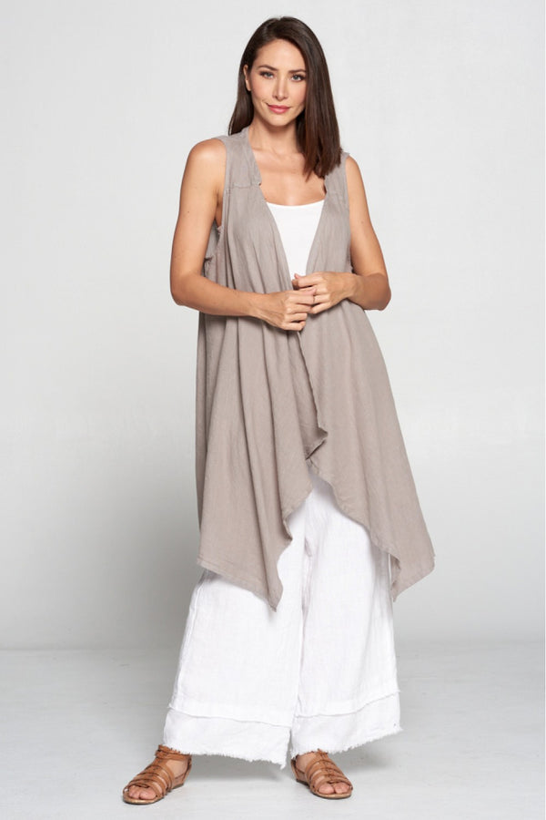 Long black sleeveless open front duster vest styled with graphic tee, gingham pants, and black beaded necklace on hanger - 14