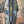 Load image into Gallery viewer, Boho patchwork denim cardigan with floral and aztec prints, large patch pockets, open front, styled with green necklace - 4
