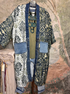 Boho patchwork denim cardigan with floral and aztec prints, large patch pockets, open front, styled with green necklace - 4