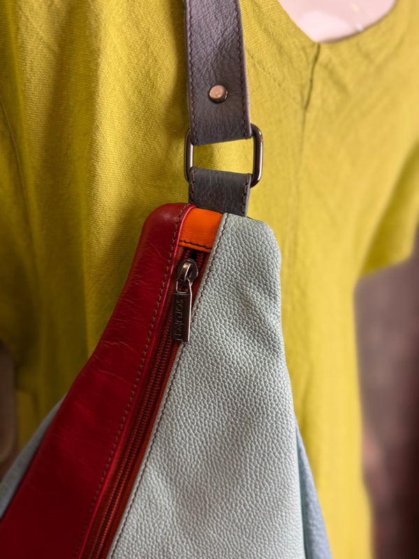 Soruka multicolor leather sling crossbody bag in light blue, red, and teal with orange zipper detail - 2