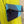 Load image into Gallery viewer, Mila color-block crossbody bag in teal, blue, and navy leather with turquoise strap, styled on mannequin with lime dress - 4
