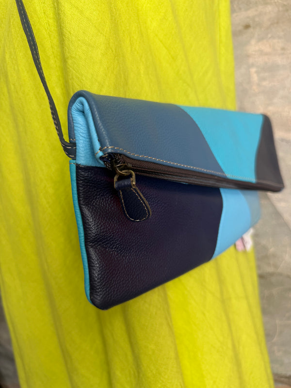 Mila color-block crossbody bag in teal, blue, and navy leather with turquoise strap, styled on mannequin with lime dress - 4