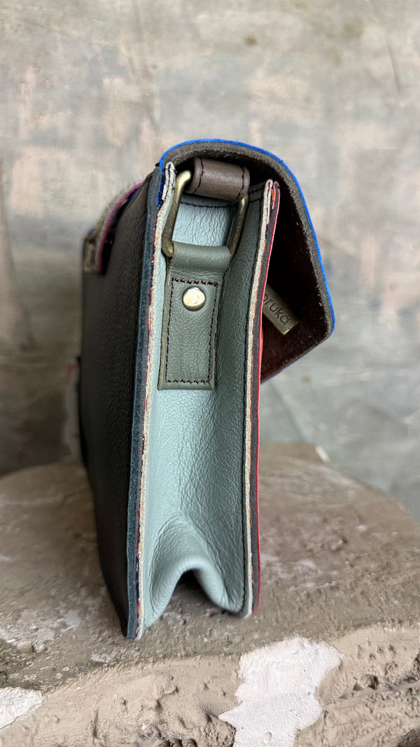 Goruka Grace Reversible Loop-B colorblock leather bag in blue, burgundy, orange with zebra print strap on stone column - 6