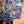 Load image into Gallery viewer, Oversized crew pullover in vibrant multicolor abstract print with flower necklace, paired with black pants on mannequin - 7
