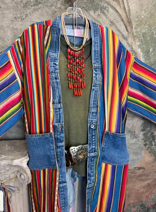 Boho serape striped duster cardigan with denim pockets, styled with red bead necklace and belt on mannequin - 8