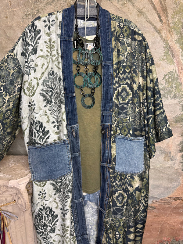 Boho patchwork denim cardigan with floral and aztec prints, large patch pockets, open front, styled with green necklace - 7