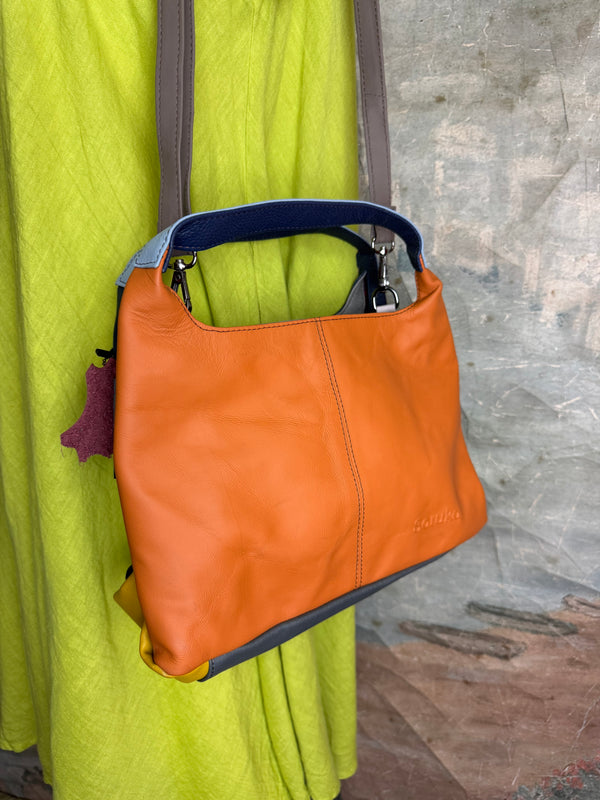 Soruka orange multicolor leather crossbody bag with gray strap on lime green linen dress mannequin - 8