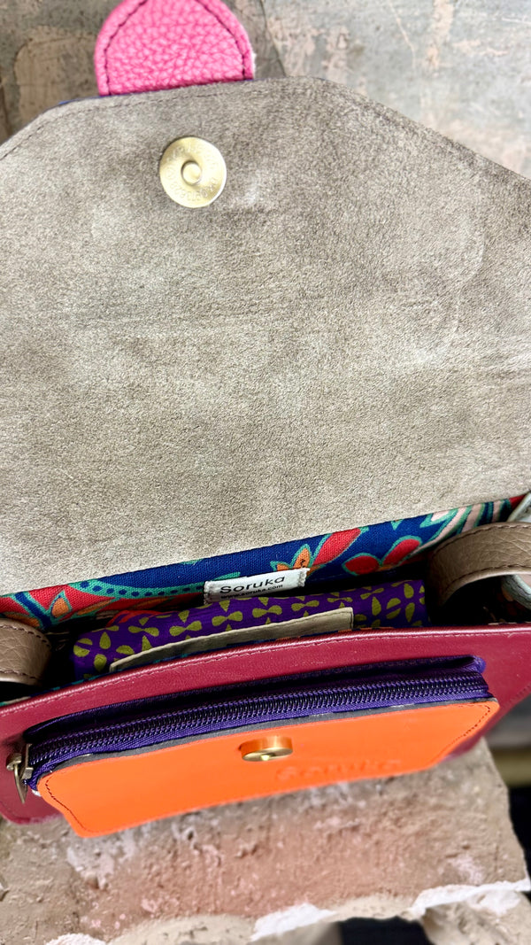 Goruka Grace Reversible Loop-B colorblock leather bag in blue, burgundy, orange with zebra print strap on stone column - 5