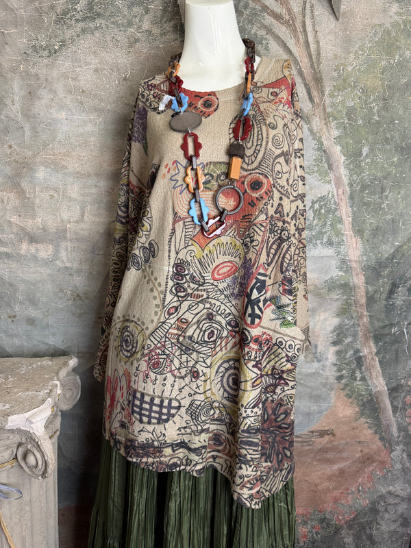 Boho waffle knit tunic top with abstract art print in earthy tones, styled with colorful chain necklace on mannequin - 16
