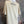 Load image into Gallery viewer, Beige t-shirt with 'Jaded Glory' text on a mannequin against a textured gray background
