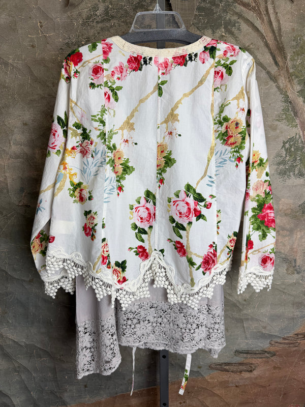 White floral kimono cardigan with pink roses and crochet lace trim displayed over gray tank top on hanger - 4