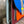 Load image into Gallery viewer, Goruka Grace Reversible Loop-B colorblock leather bag in blue, burgundy, orange with zebra print strap on stone column - 8
