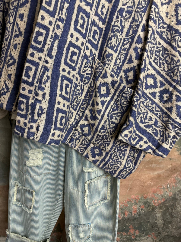 Blue white shibori ikat print kimono jacket open front boho style layered over floral tee with flower necklace - 6