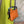 Load image into Gallery viewer, Soruka orange multicolor leather crossbody bag with gray strap on lime green linen dress mannequin - 6
