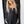 Load image into Gallery viewer, Woman wearing TBN3980 Comfort Jumpsuit in charcoal gray, long sleeve wide leg style with button front detail - 2
