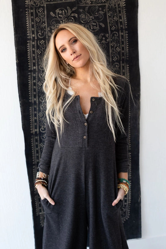 Woman wearing TBN3980 Comfort Jumpsuit in charcoal gray, long sleeve wide leg style with button front detail - 2