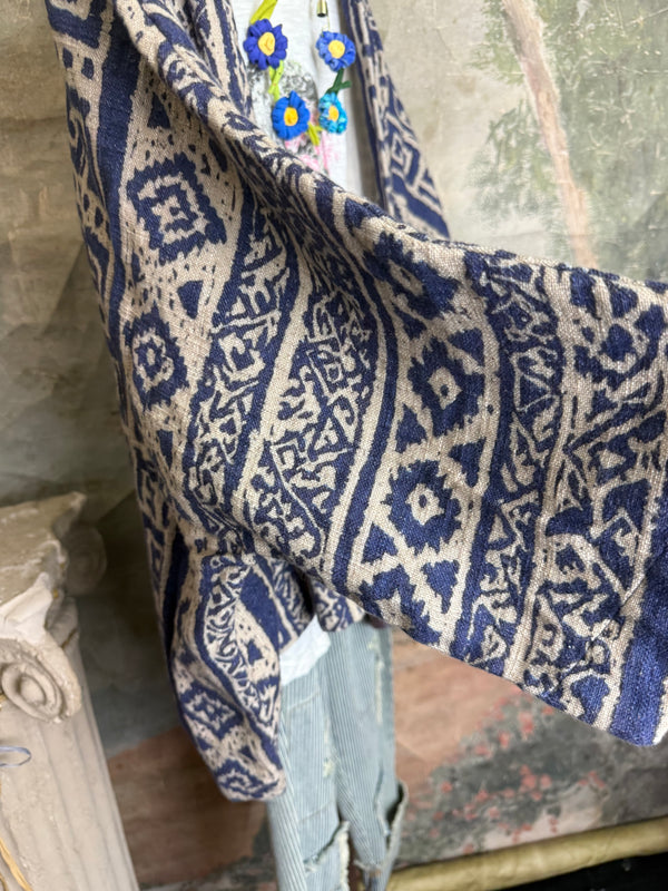 Blue white shibori ikat print kimono jacket open front boho style layered over floral tee with flower necklace - 10