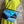 Load image into Gallery viewer, Mila color-block crossbody bag in teal, blue, and navy leather with turquoise strap, styled on mannequin with lime dress - 7
