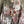 Load image into Gallery viewer, Tie-dye floral kimono duster in pink and olive with gold rose print, styled with colorful disc necklace - 2
