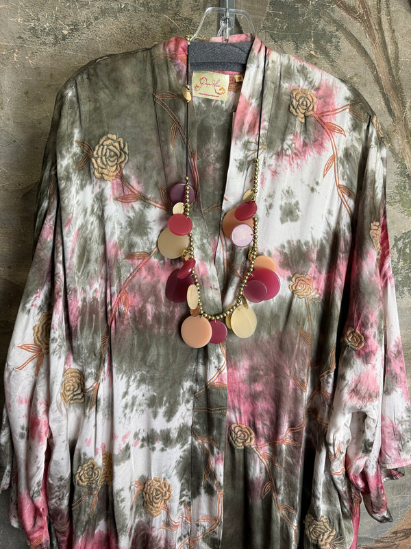 Tie-dye floral kimono duster in pink and olive with gold rose print, styled with colorful disc necklace - 2