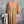 Load image into Gallery viewer, Woman wearing DYM90081 Bloomspell Maxi Dress in orange floral print with pink Converse sneakers in boutique setting - 10
