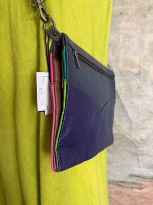 Soruka Mei crossbody bag in pink and navy leather with polka dot detail on mannequin with lime green dress - 2
