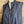 Load image into Gallery viewer, Long denim zip-front sleeveless vest with drawstring hem displayed on mannequin, boutique Merritt style - 6
