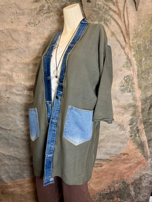 Olive green ribbed cotton cardigan with denim patchwork LOVE letters on back, displayed on mannequin - 14