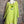 Load image into Gallery viewer, Mannequin wearing a green top with a colorful pendant against a textured wall.
