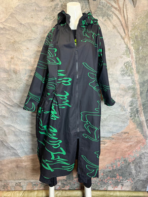 Black oversized hooded maxi jacket with green abstract scribble print, gathered back detail, long sleeves, shown on mann - 31