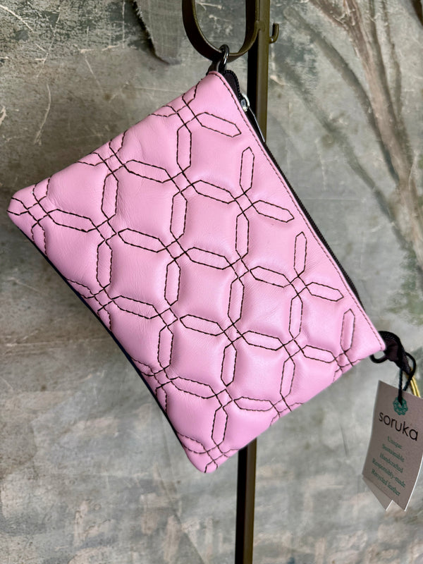Pink leather quilted crossbody bag with geometric stitching pattern and black adjustable strap on lime green dress - 5