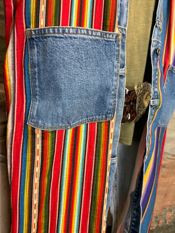 Boho serape striped duster cardigan with denim pockets, styled with red bead necklace and belt on mannequin - 15