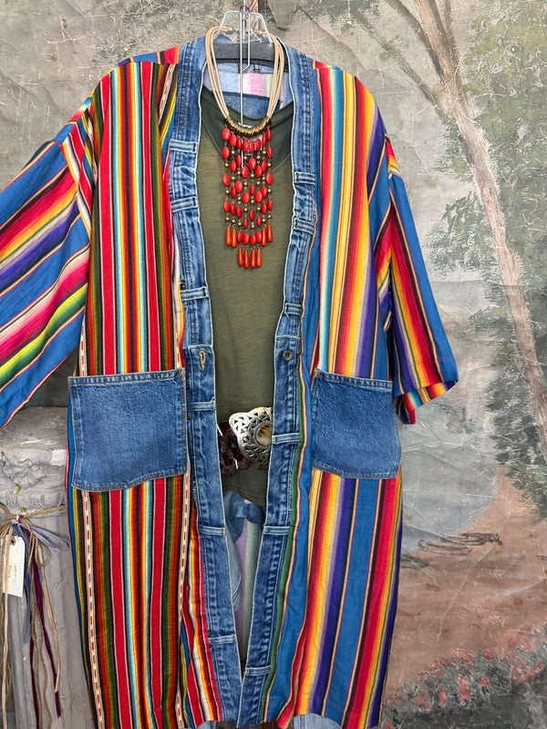 Boho serape striped duster cardigan with denim pockets, styled with red bead necklace and belt on mannequin - 3