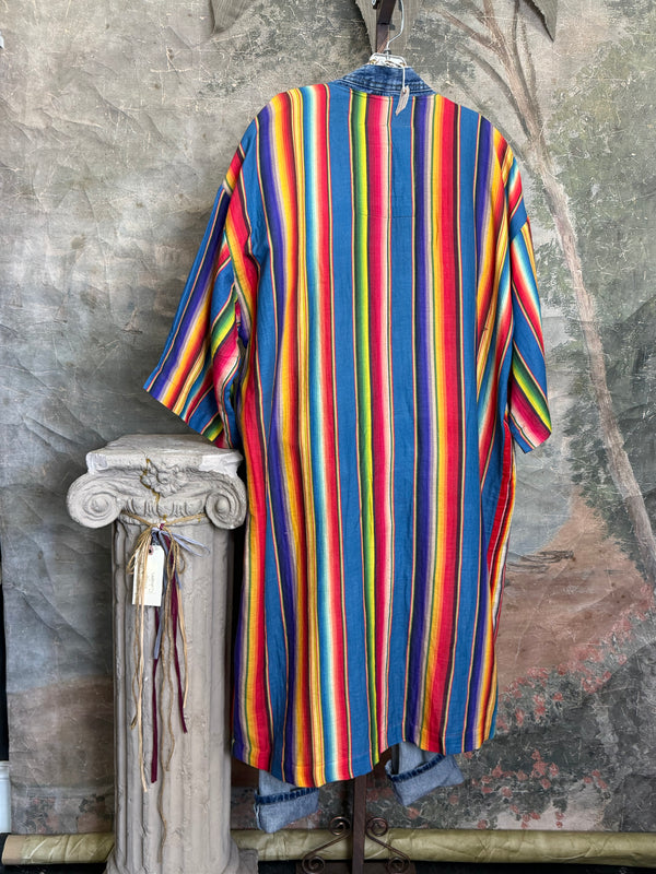Boho serape striped duster cardigan with denim pockets, styled with red bead necklace and belt on mannequin - 18