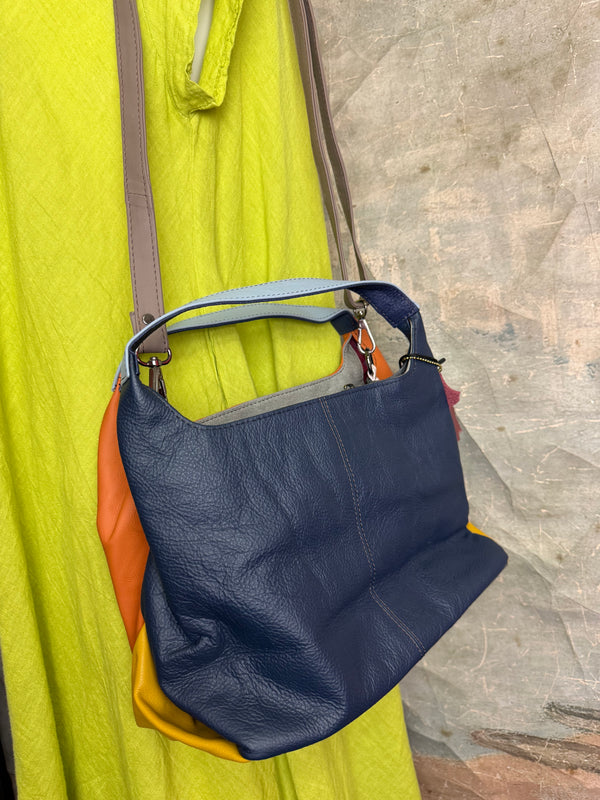 Soruka orange multicolor leather crossbody bag with gray strap on lime green linen dress mannequin - 12
