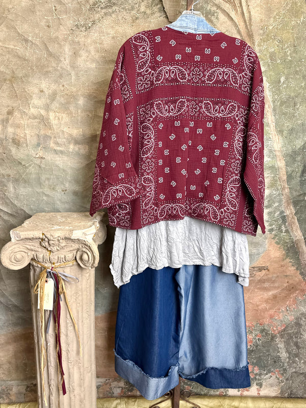 Burgundy bandana print short kimono with denim pocket accents, layered over white top and blue denim skirt with bead nec - 10