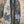 Load image into Gallery viewer, Boho patchwork denim cardigan with floral and aztec prints, large patch pockets, open front, styled with green necklace - 2
