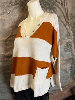 White and rust orange striped knit pullover sweater with V-neck, side pockets, and statement pendant necklace on mannequ - 6