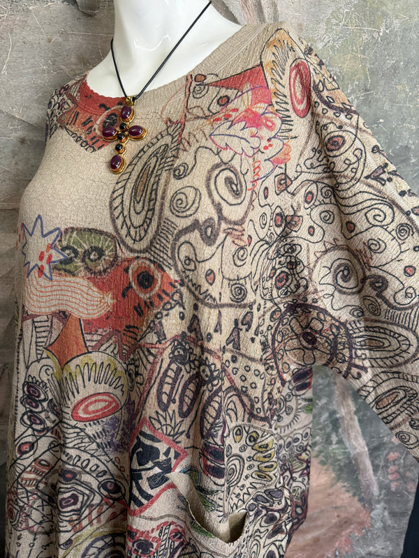 Boho waffle knit tunic top with abstract art print in earthy tones, styled with colorful chain necklace on mannequin - 4