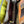 Load image into Gallery viewer, Soruka orange multicolor leather crossbody bag with gray strap on lime green linen dress mannequin - 10

