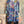 Load image into Gallery viewer, Oversized crew pullover in vibrant multicolor abstract print with flower necklace, paired with black pants on mannequin - 2
