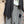 Load image into Gallery viewer, Long black sleeveless open front duster vest styled with graphic tee, gingham pants, and black beaded necklace on hanger - 10
