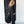 Load image into Gallery viewer, Woman wearing TBN3980 Comfort Jumpsuit in charcoal gray, long sleeve wide leg style with button front detail - 3
