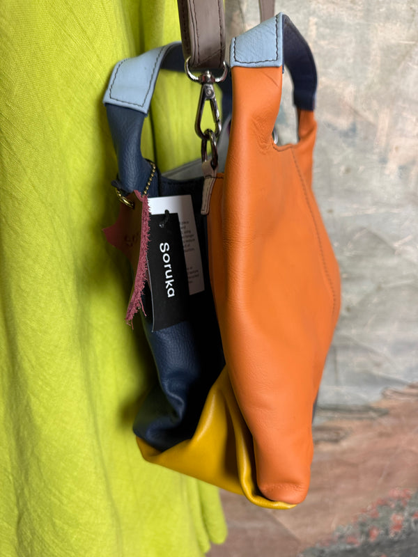 Soruka orange multicolor leather crossbody bag with gray strap on lime green linen dress mannequin - 9