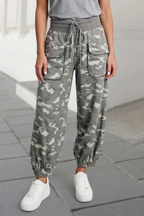 Woman wearing gray camouflage cargo jogger pants with patch pockets and white crop top, casual street style outfit - 6