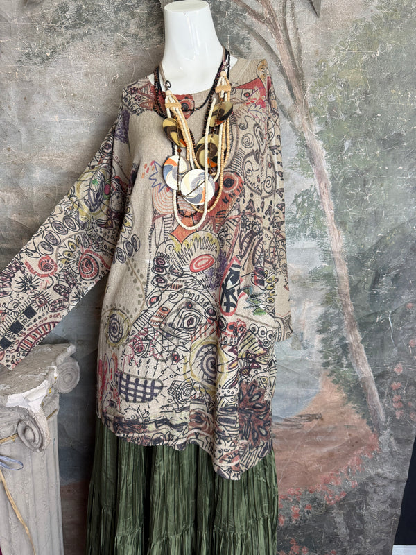Boho waffle knit tunic top with abstract art print in earthy tones, styled with colorful chain necklace on mannequin - 15